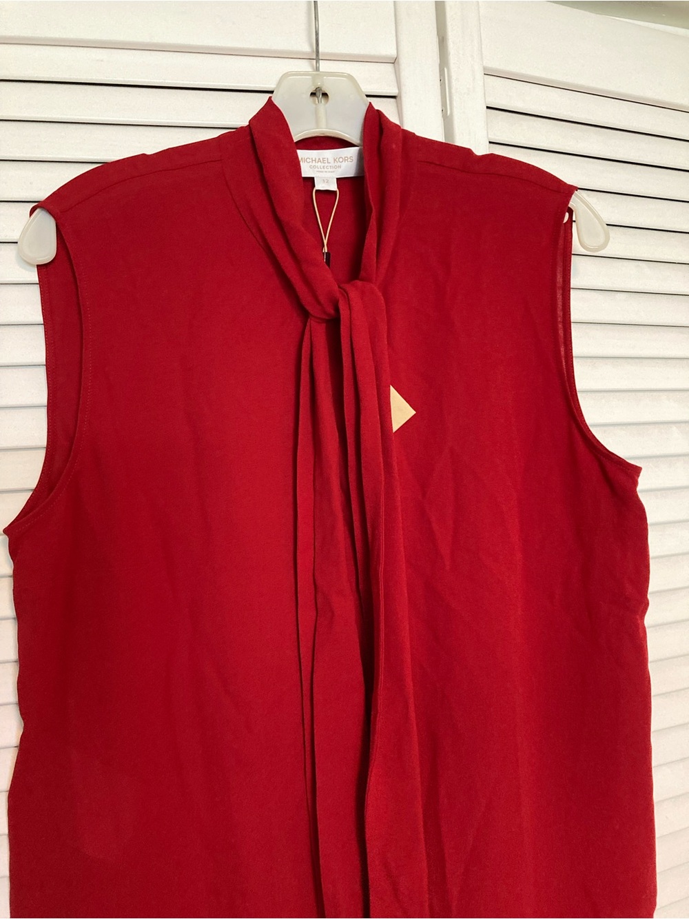 Michael Kors Collection Red Sleeveless Tie-Neck silk top.